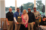 Leigh Kennedy and Brian Holland with the winning team from Electric Motor & Contracting Co., Inc.